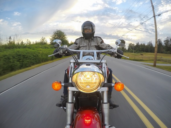 POV of a motorcyclist riding down the road.